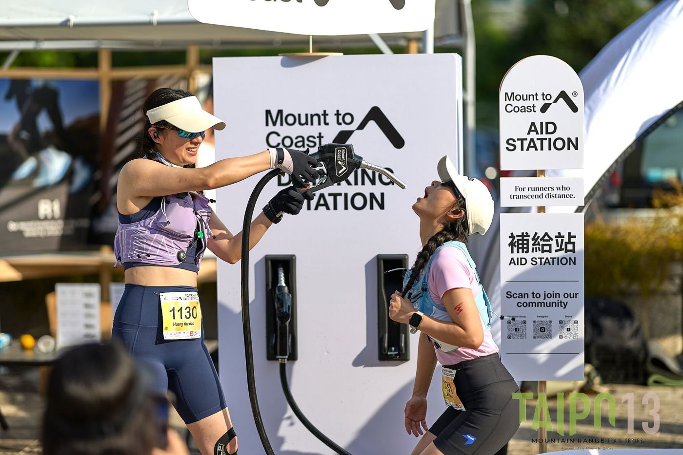Runners refilling at the Mount to Coast aid station