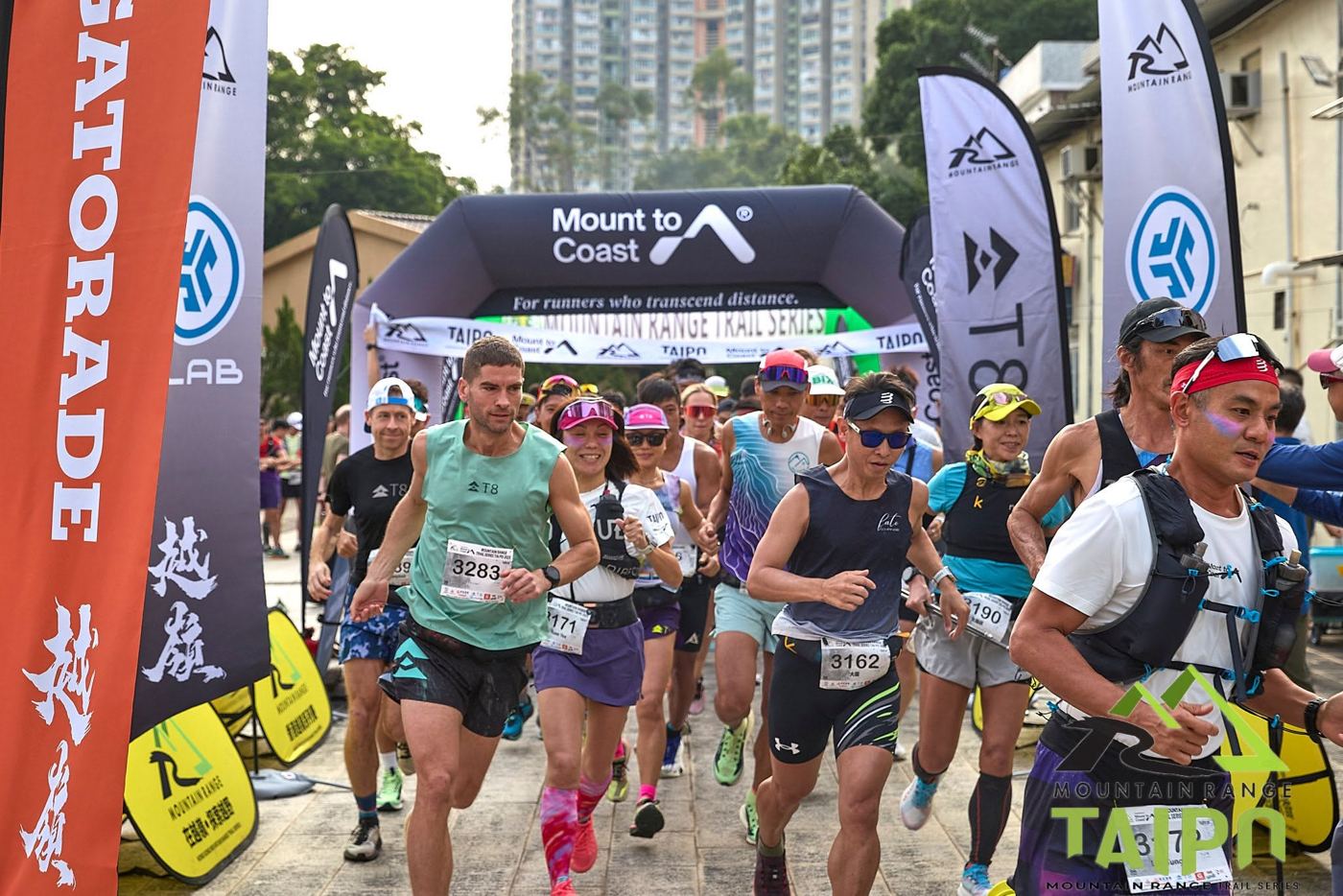 Race start under the Mount to Coast arch at the Taipo trail race