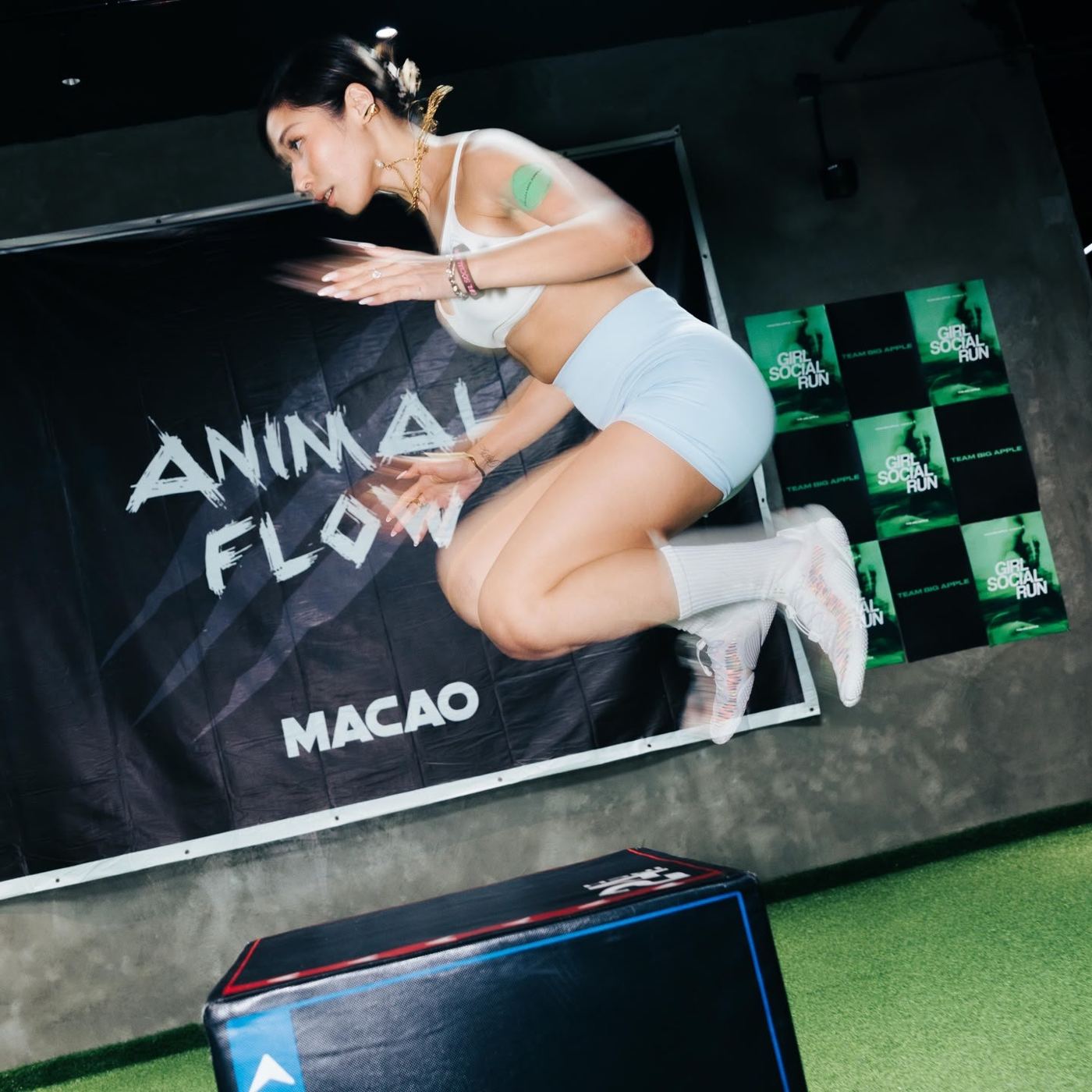 Animal Flow community fitness session in Macao, athlete jumping onto a box